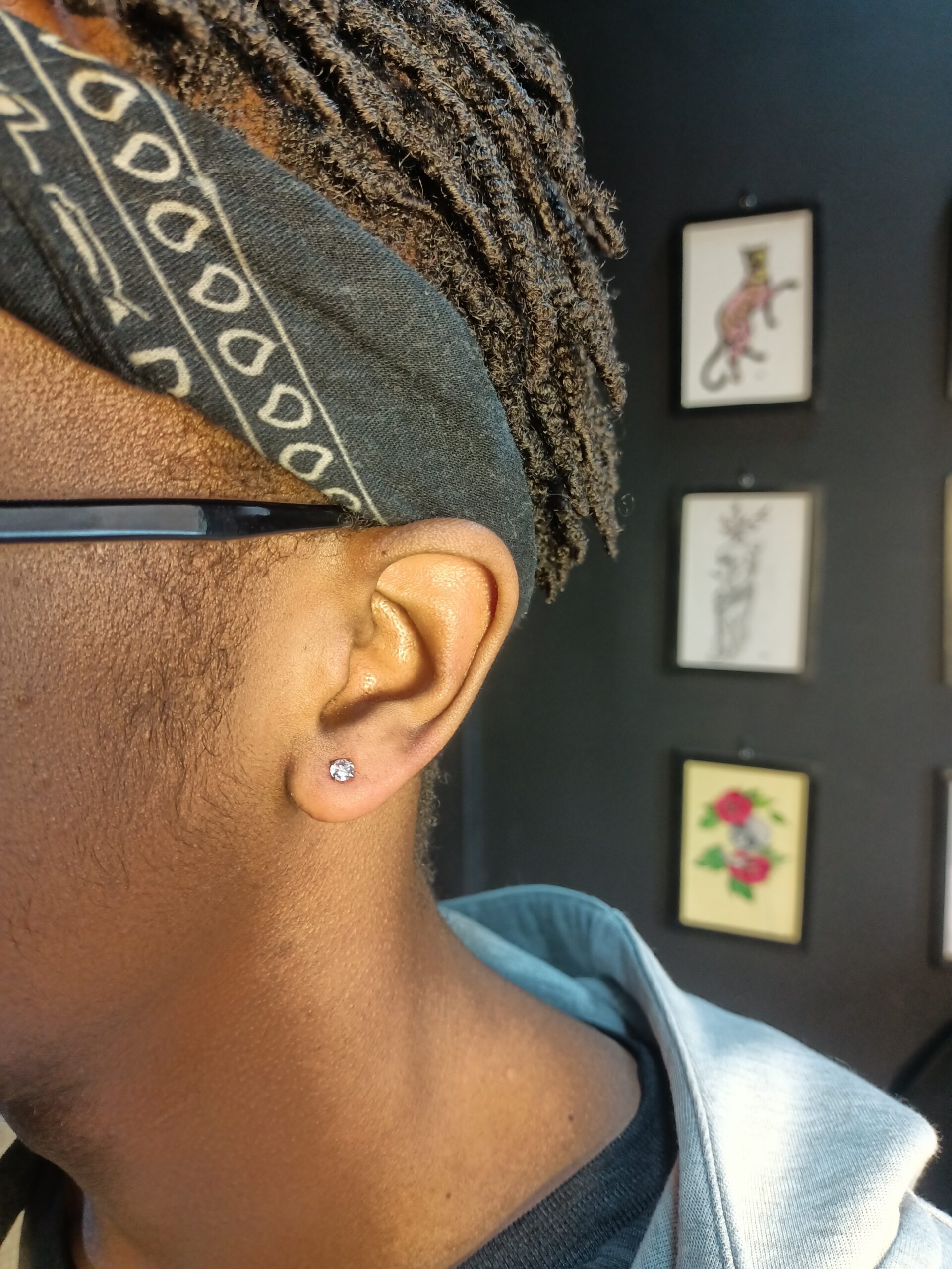 Ear lobe piercing at Tattoo Lust Studio